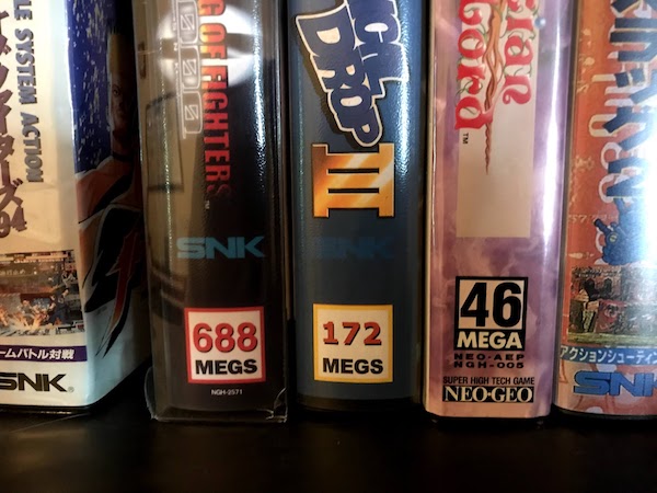 A shelf with some Neo Geo games, showing the numbers