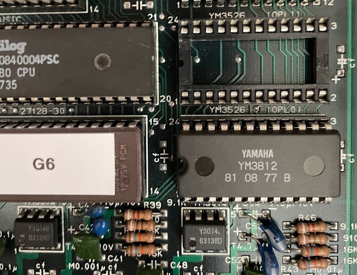 An empty socket, and a socketed chip below it labeled YM3812