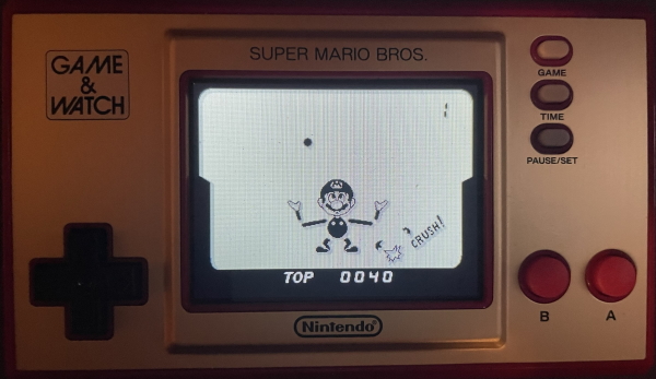 Game and Watch 'Ball'. It's actually a modern Nintendo color screen Game & Watch