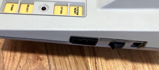 The Atari 400's side, including the SIO port and power plug