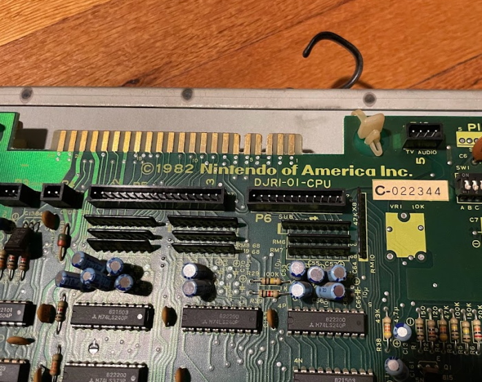An edge connector, a Nintendo of America logo, and the serial DJRI-01-CPU