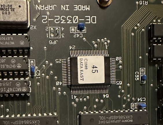 A chip with a Data East copyright and the number 45