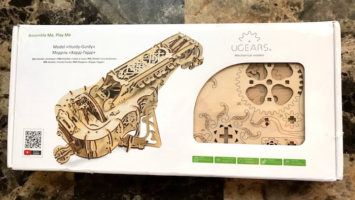 A boxed UGears hurdy-gurdy kit