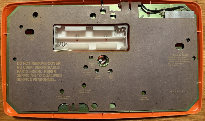 The Magnavox Odyssey 100 rear, showing off its warning-covered cardboard cover
