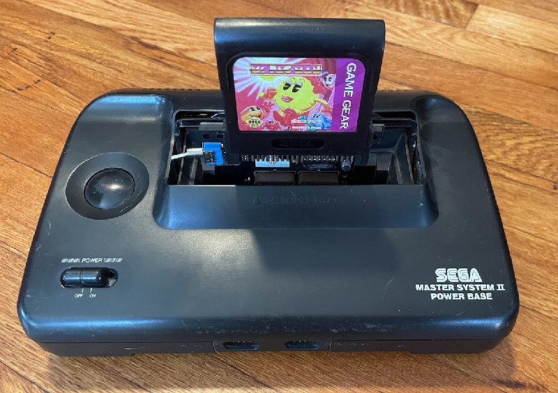 Ms. Pac Man for the Game Gear, attached into a Master System