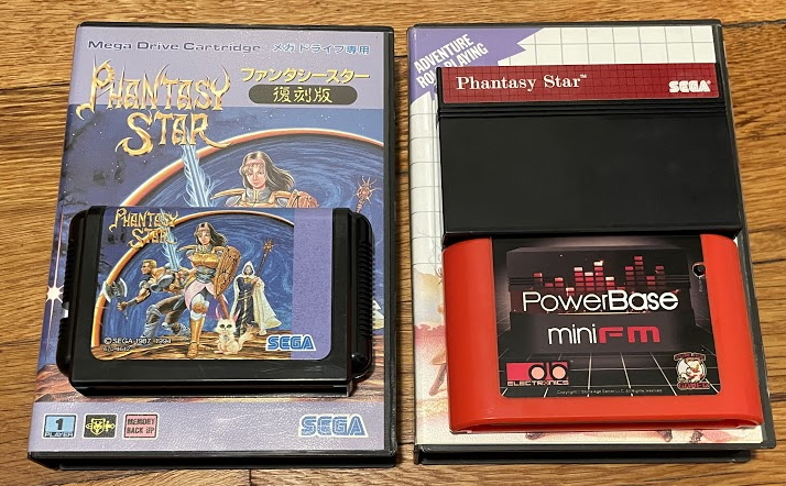 Phantasy Star Fukkokuban, a Japanese Genesis game, next to a US Phantasy Star cart in a dB electronics PowerBase Mini FM