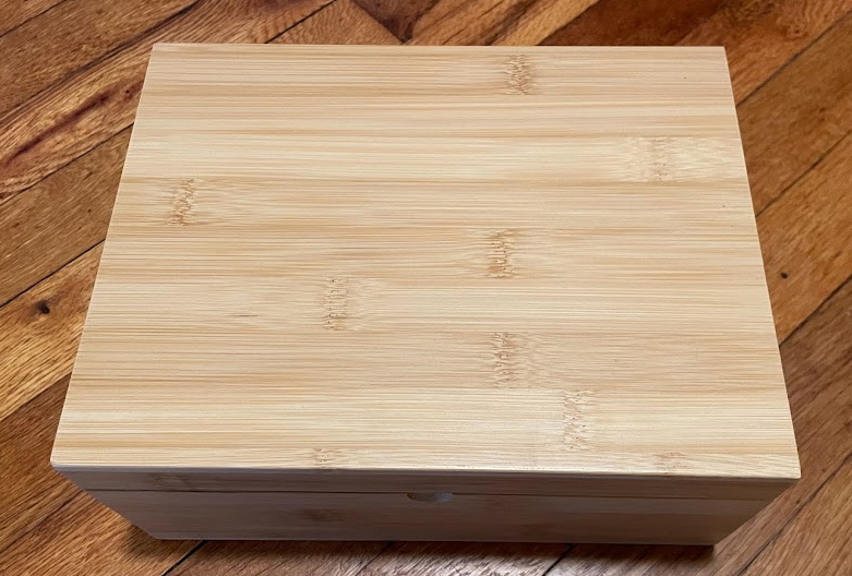 A bamboo box on a hardwood floor