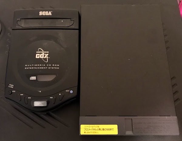 A Sega CDX compared to the PAC S-1
