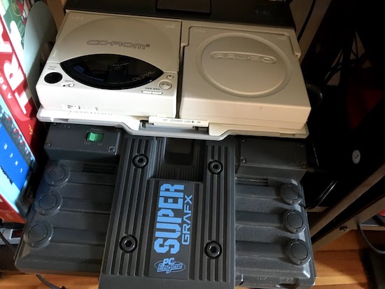 The PC Engine Interface Unit connected to the SuperGrafx, stacked to be less of a mess