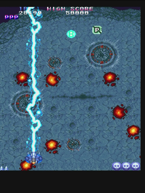 Truxton, the player using a blue full-screen laser