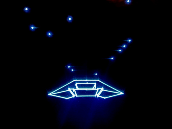 a Vectrex screen playing Mine Storm showing a spaceship made of lines
