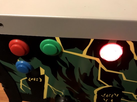 The side of the modded pinball, showing flipper buttons.