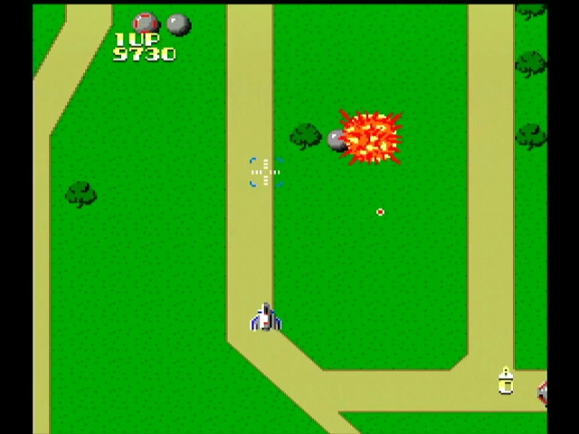 Xevious gameplay. A bomb blows up a ground emplacement