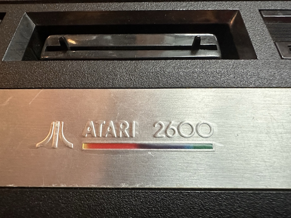 An Atari logo with a small rainbow line