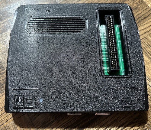 I love the 3d-printed icons above the ports but they didn't photograph great here Black 3d printed case with a big sideways cartridge slot