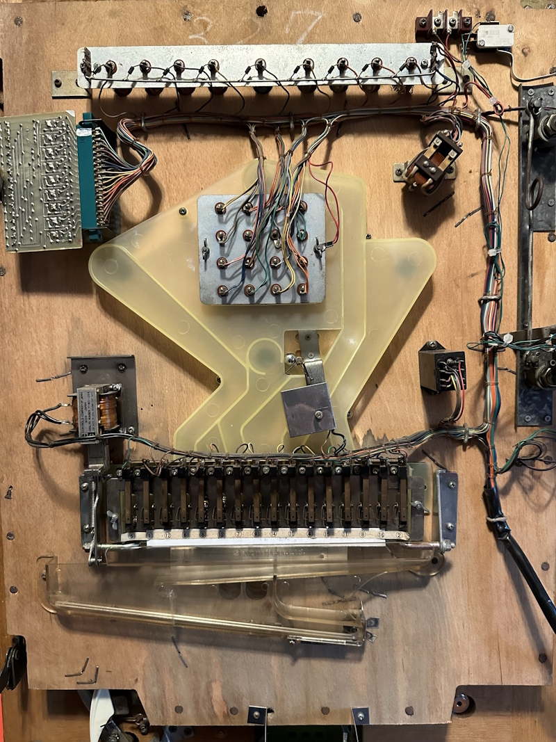 Inside of the machine, showing wires and switches