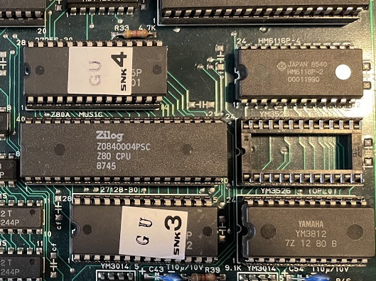 A board identical to the above but with an SNK sticker on the EPROM with a GU code