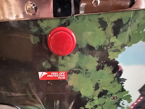 there's some on the playfield too A protective film around the button