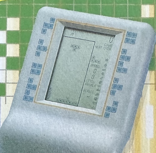 better graphics than the microvision The Talking Brick Game 118 in 1 packaging, showing the screen