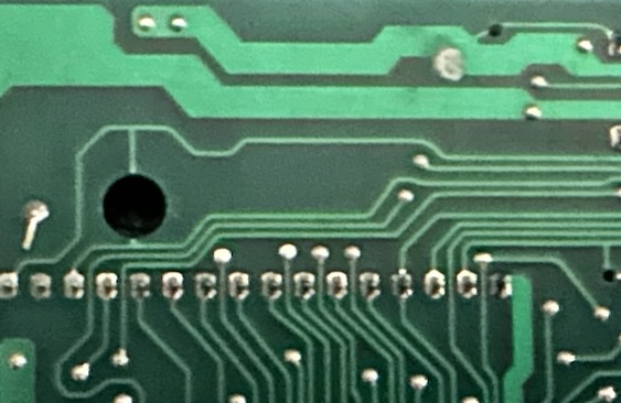 Traces cut by various holes in the PCB