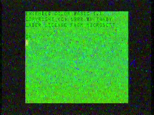 we extended color basic too far, not realizing the risk Very noisy screenshot of the Tandy Color Computer boot screen
