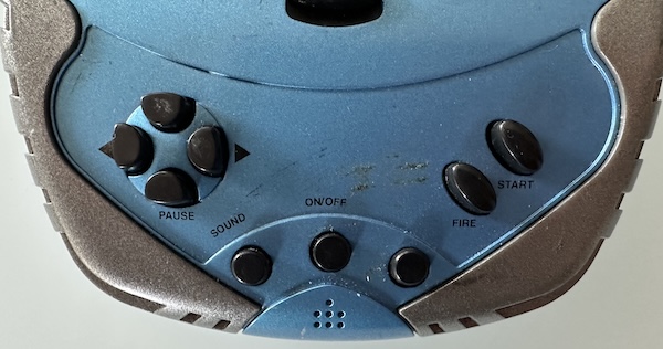 The blue and grey space invaders, showing how the controller features buttons that aren't labeled at all