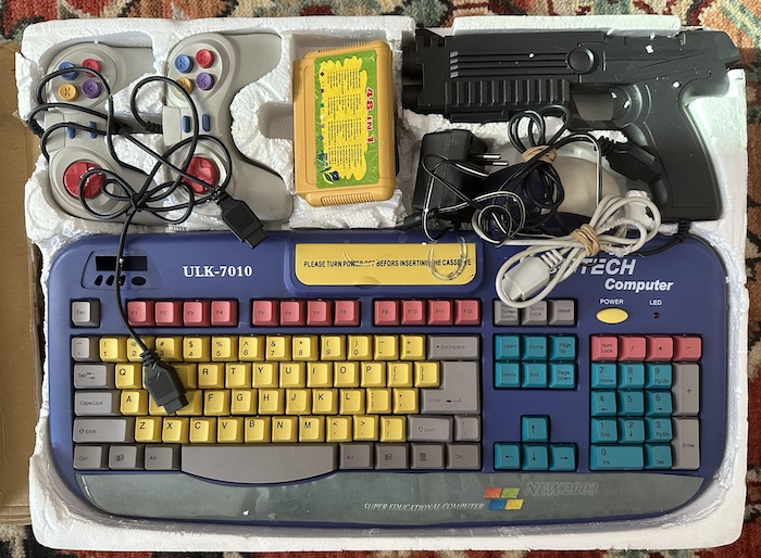 The computer, two controllers, a mouse, a gun, a cartridge, a power supply