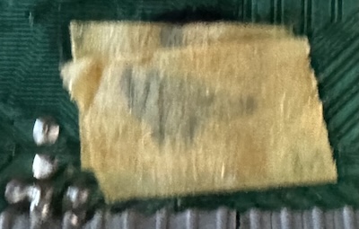 A piece of masking tape with something written on it