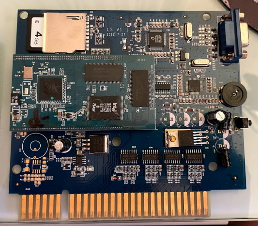 Circuitboard of the pirate JAMMA board. It has a daughterboard mounted, and an SD card near the top.