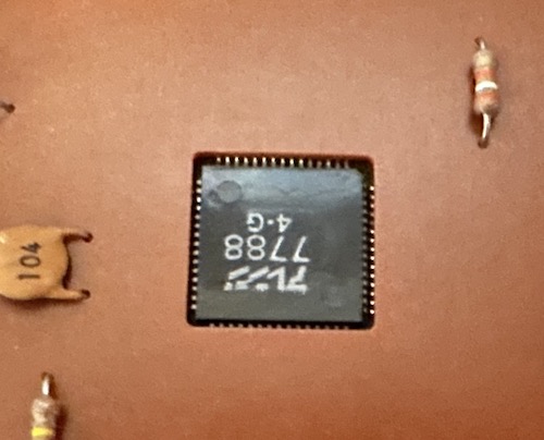 A small chip in a hole in the PCB