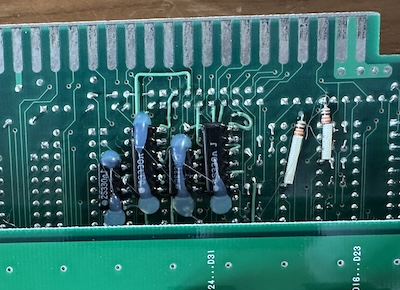 Some hand-soldered components on the underside of the JAMMA edge.