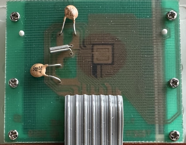 the die Zoom in on the top PCB, showing an epoxy blob