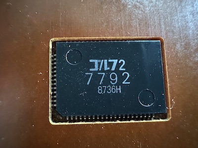 you're telling me you put two whole golfs in this tiny chip?! Chip labeled 'gorufu 2' in katakana. Below it says 7792 in large numbers, 8736H in smaller numbers