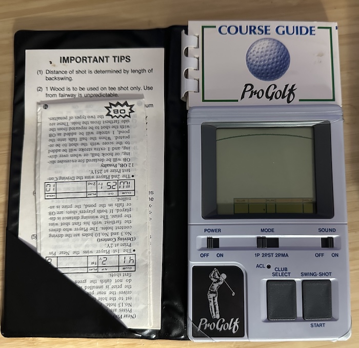 Clearly used, but used by someone who took decent care of it Interior of the golf game, as described above