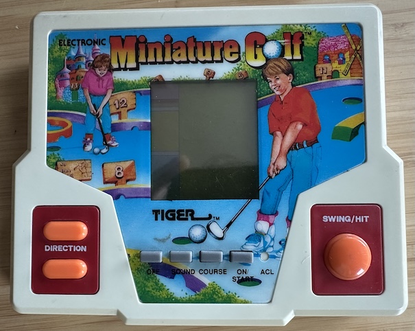 a bit yellowed because it doesn't have a box to live in Tiger Miniature Golf on its own