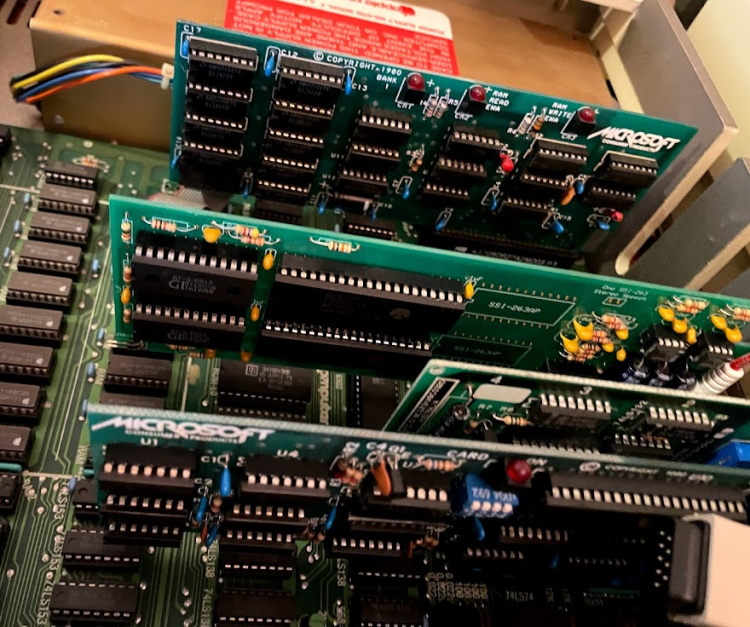 The inside of an Apple II. Cards are installed, including the Mockingboard.