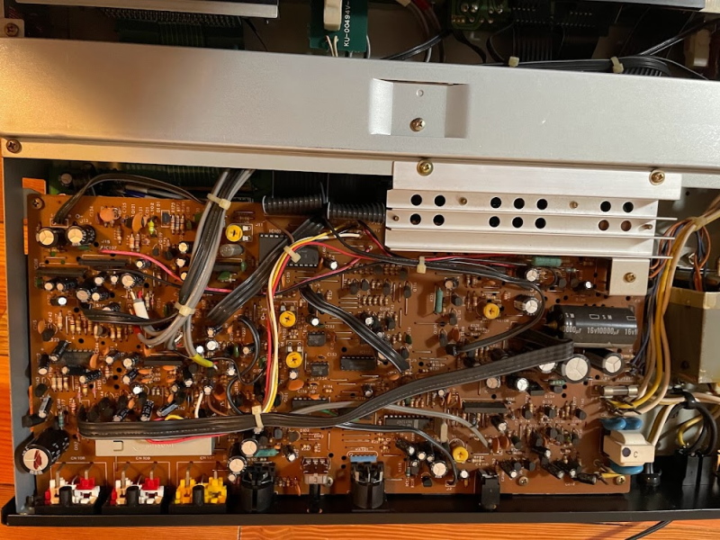 Inside of the PX-V7, shjowing a complex (but single-sided) circuitboard with many analog components