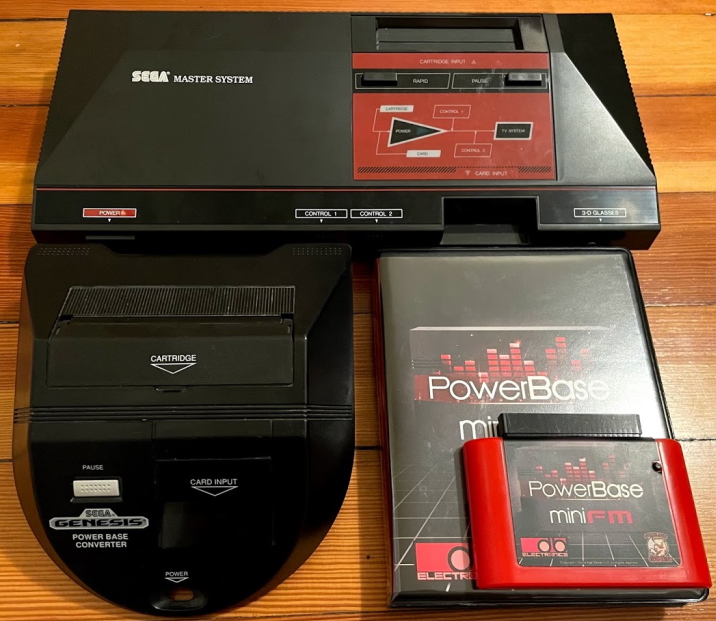 A Master System, a Power Base Converter, and a PowerBase Mini FM