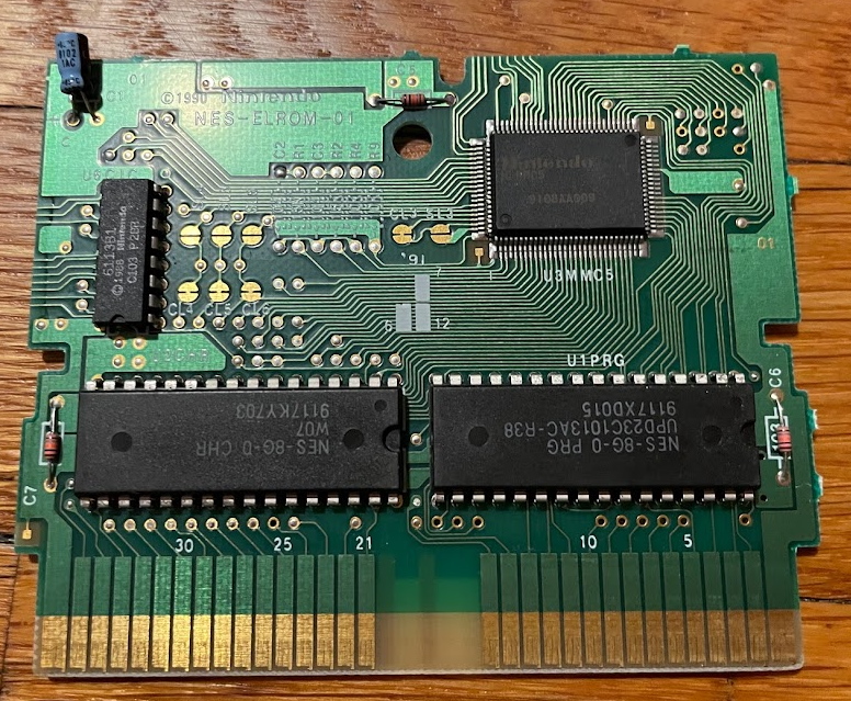 Laser Invasion circuit board. It's bigger than the other boards we've seen, and the MMC5 chip is a large surface-mount part