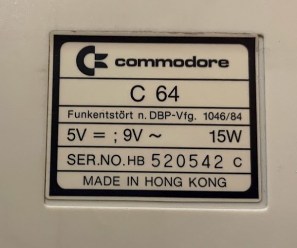 The serial badge of my Commodore 64C, with German text