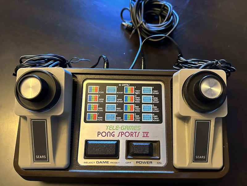 Pong Sports IV, a small brown plastic box with two detachable joysticks