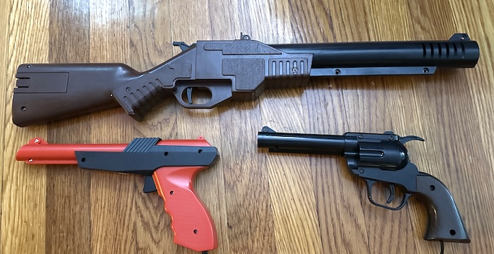 the long rifle-like gun compared to smaller pistol and laser-pistol like guns. don't worry, they're all plastic