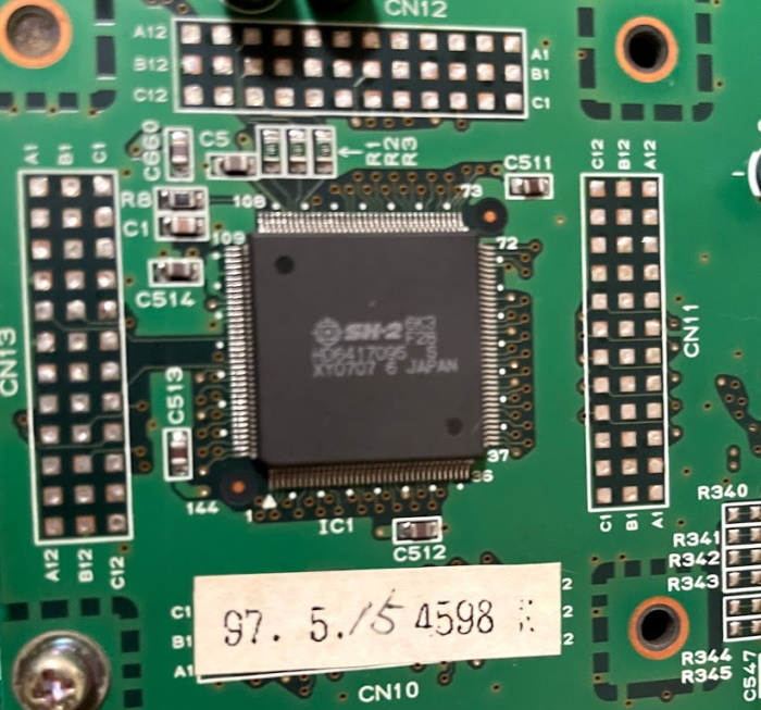 The Sega ST-V SH-2 CPU. Below it is a sticker with the date 1997.5.15