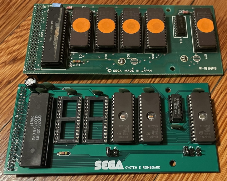 Two ROM boards for the System E, the original and the new one, both populated with ROMs