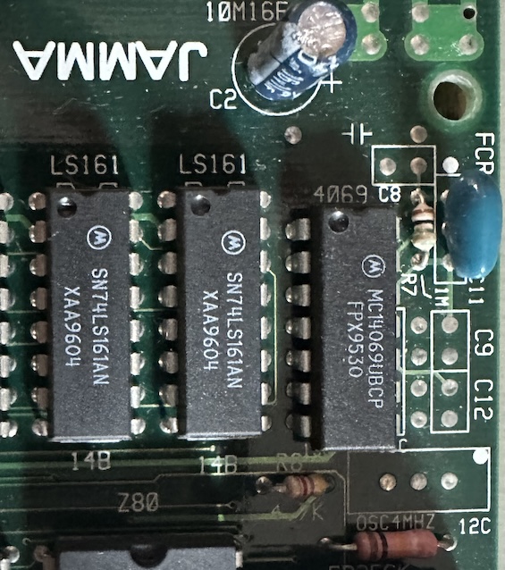 an unpopulated area on the PCB labeled '4MHZOSC'