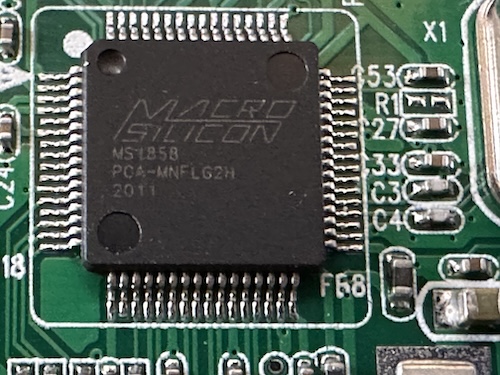 A black surface-mount chip labeled Macro Silicon