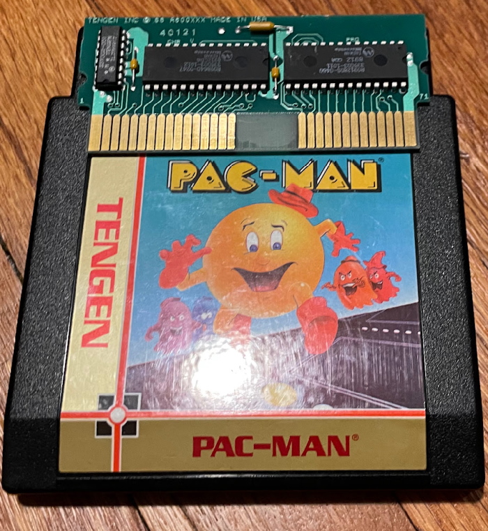 Tengen's Pac-Man with its small circuitboard