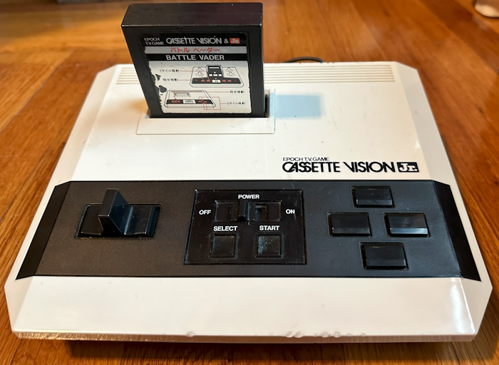 A console labeled Epoch Cassette Vision Jr, with a game called Battle Vader inside
