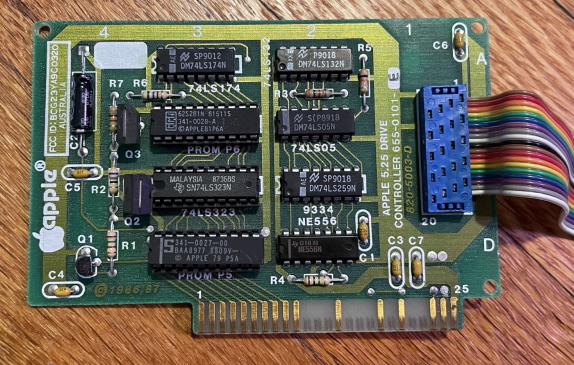The Apple 5.25 Drive Controller Card, two rows of small black ICs and a rainbow cable