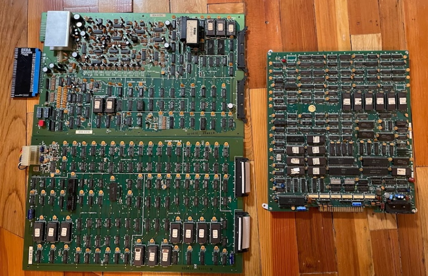 The two large Zaxxon circuitboards next to the smaller Sega System 1
